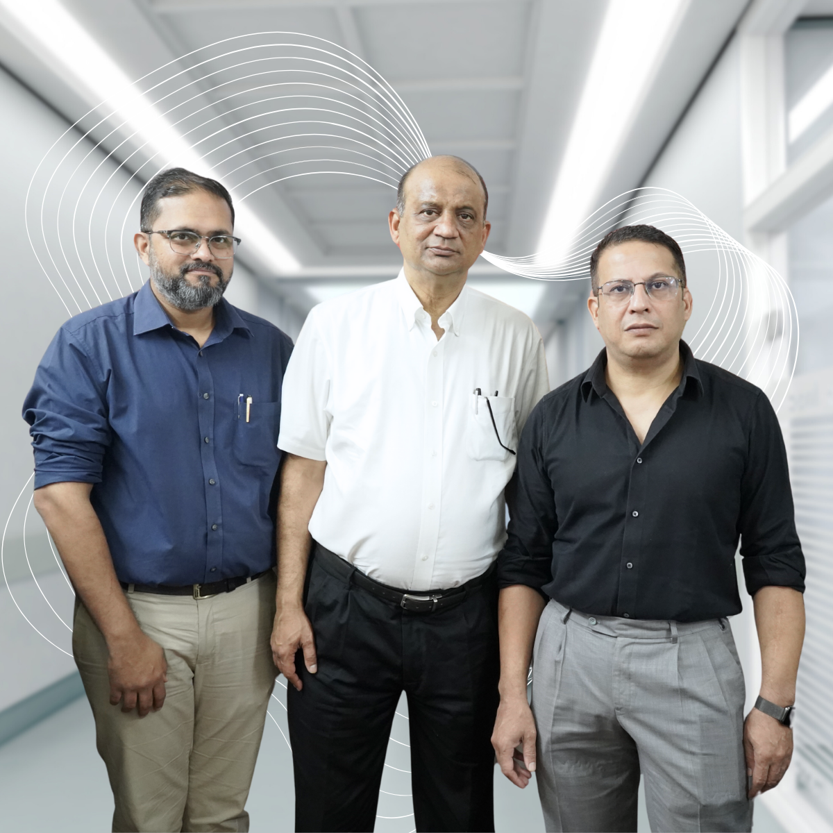 Three cardiologists standing in a hospital corridor, representing the expert cardiac team at Cardiac Care Associates, best cardiac care centre in Bhopal.